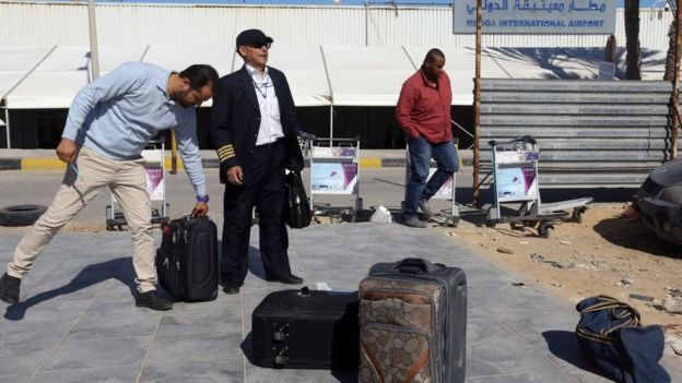 Libya crisis: Air strike at Tripoli airport as thousands flee clashes